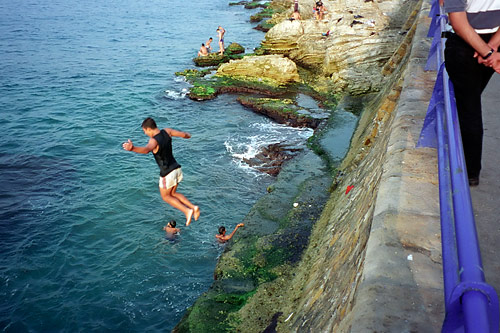 Lebanon, boy bravely jumping into the Mediterranean in Beirut