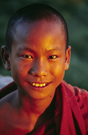 Young monk at sunset