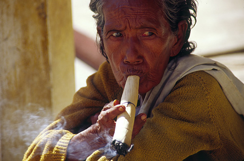 Woman smoking che root