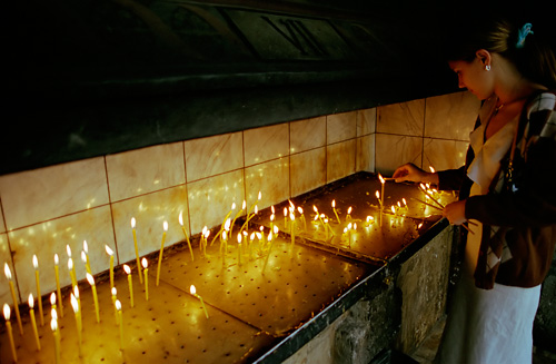 Lighting candles in Bucharest