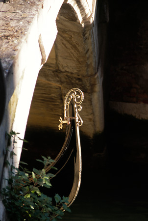 Gondola passing under bridge